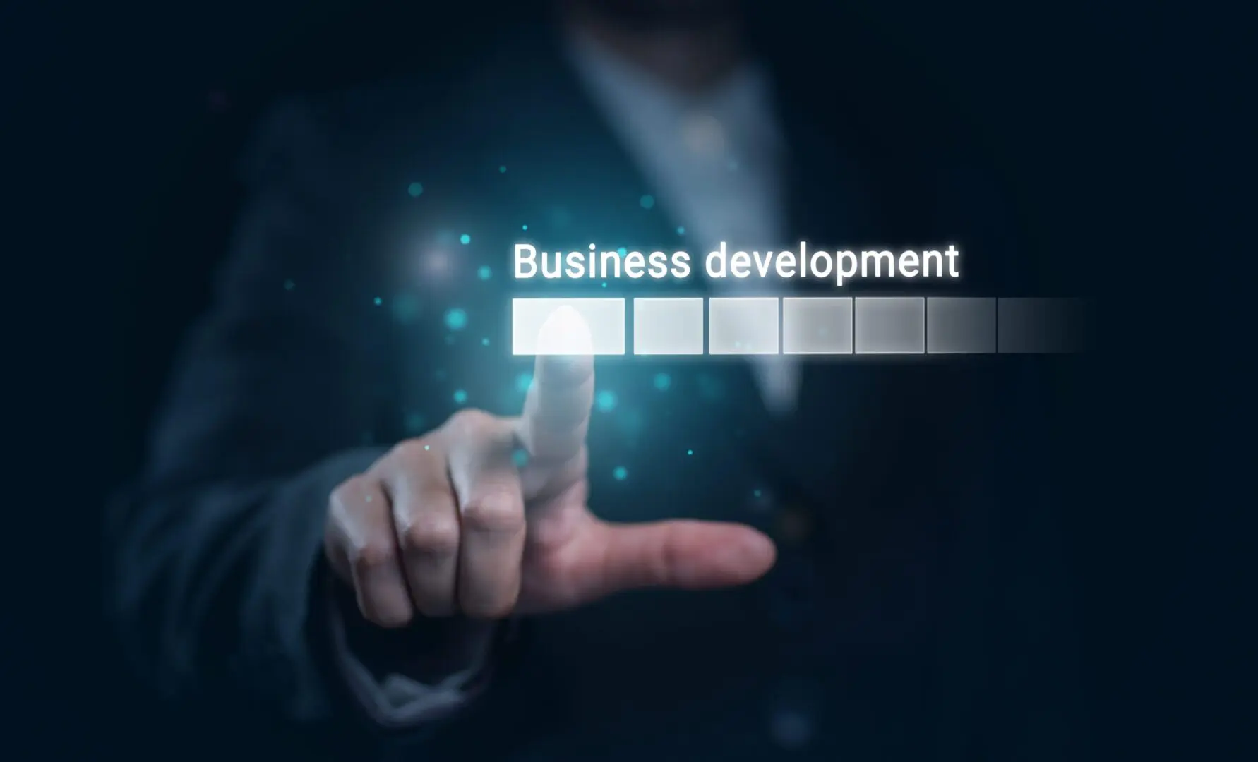 A man is touching the words business development.