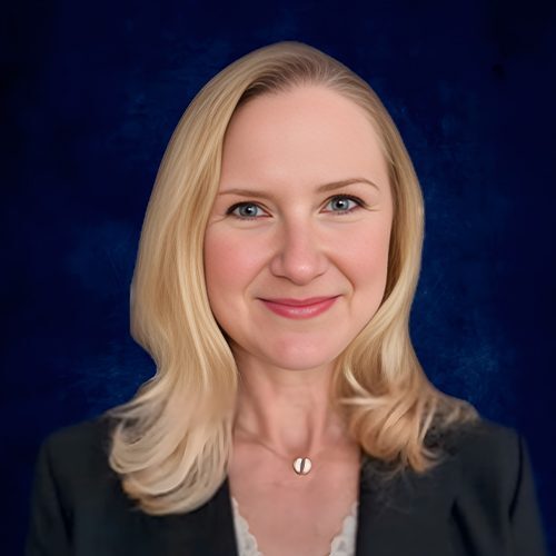 A woman with blonde hair wearing a black jacket.